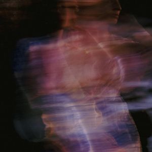 Abstract motion blur of a person exercising indoors