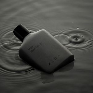 Close up of a water bottle on a black surface