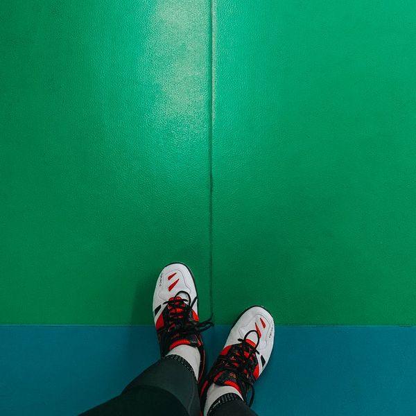 Detail of a sneaker hitting the floor during exercise